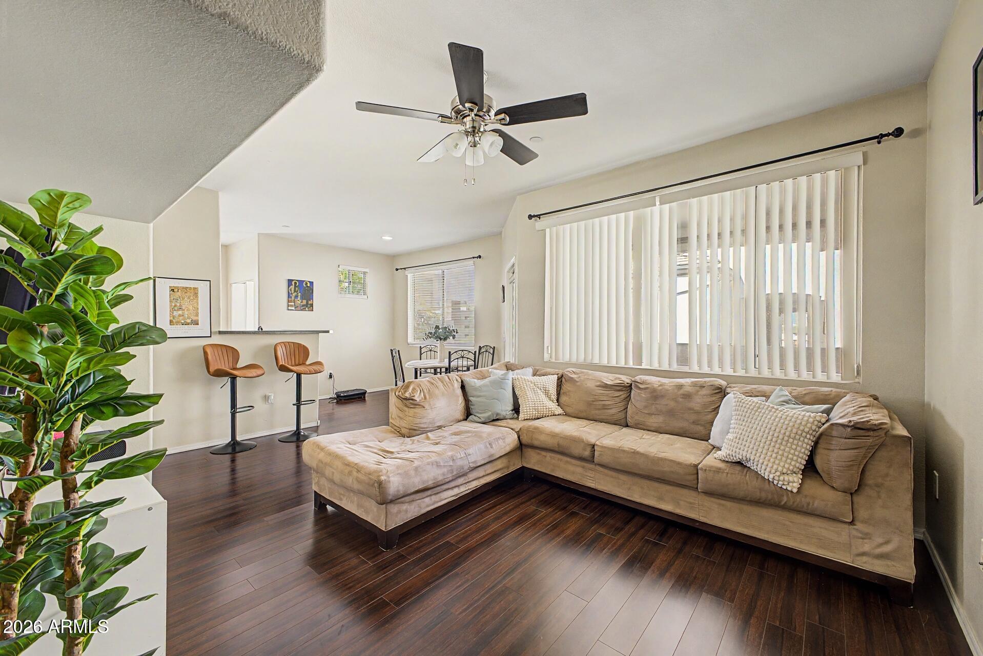 3302 North 7th Street, Unit 354 Phoenix, AZ 85014 - Photo 6 of 32 a living room with furniture and a potted plant