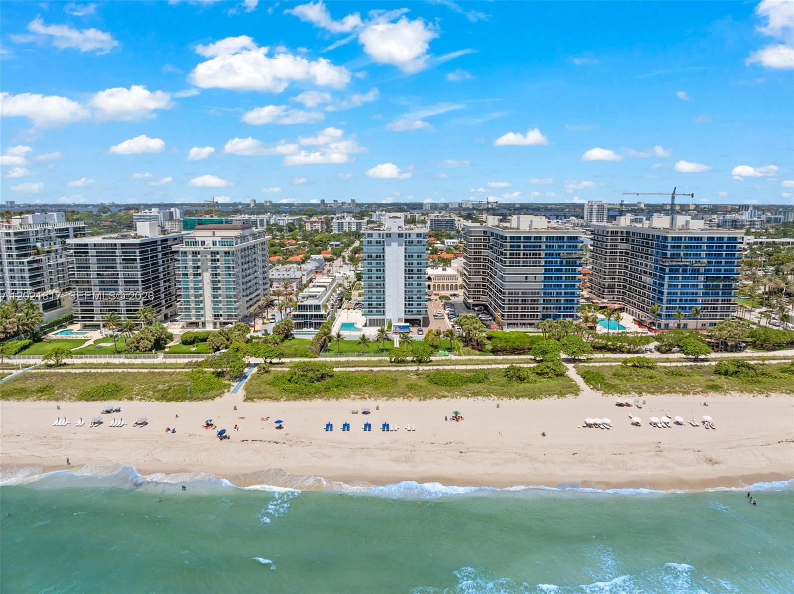 9511 Collins Avenue, Unit 1202 Surfside, FL 33154 - Photo 15 of 16 a view of swimming pool with outdoor seating and yard