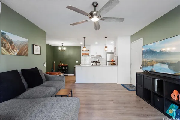 a living room with furniture and a flat screen tv