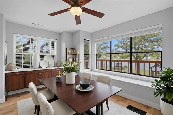 a view of a dining room with furniture window and wooden floor