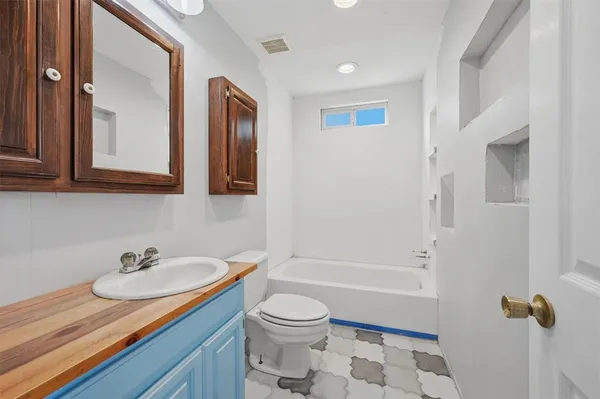 a bathroom with a sink toilet a shower and bathtub