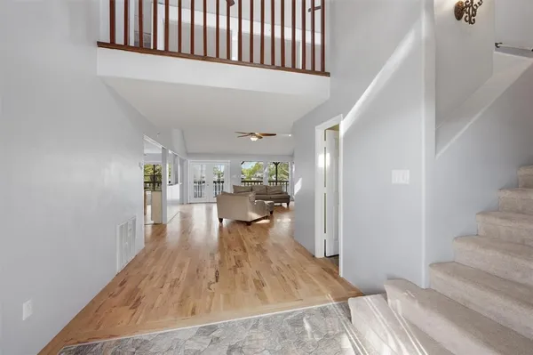 a view of a living room and entryway