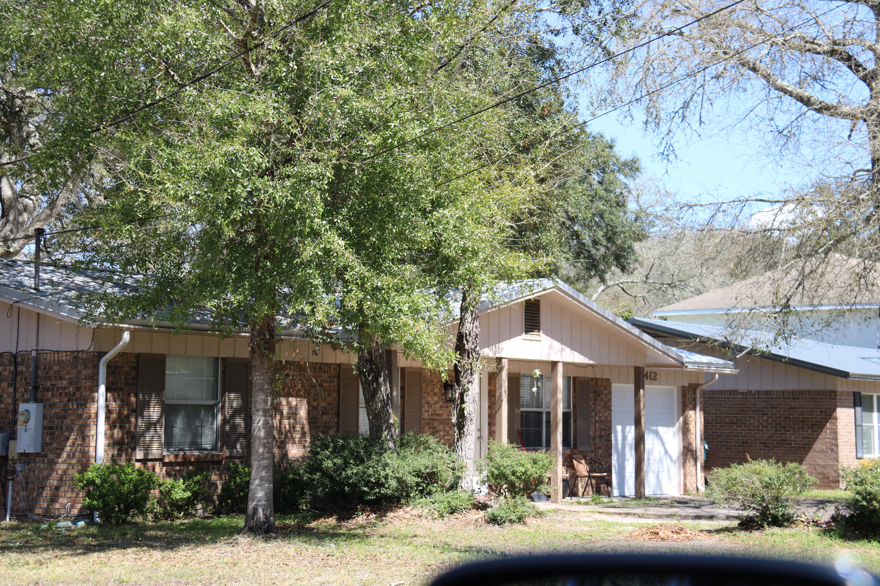 412 Bear Road Fort Walton Beach, FL 32547 - Photo 3 of 3 front view of a house with a garden