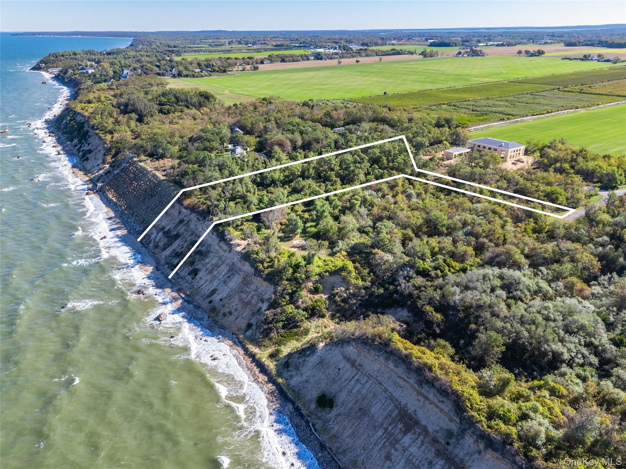 6121 Oregon Road Cutchogue, NY 11935 - Photo 22 of 22 a view of a field with an ocean view