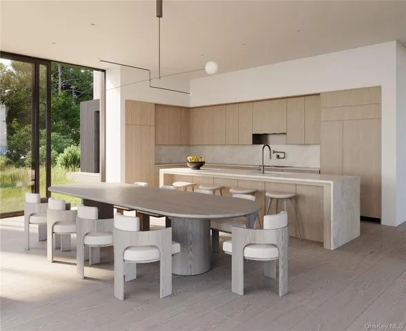 a kitchen with a sink and chairs