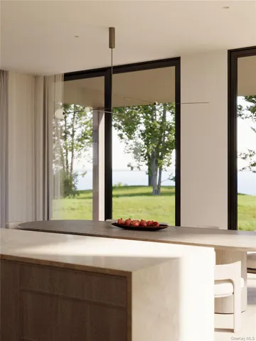 a view of a room with a large window and front door