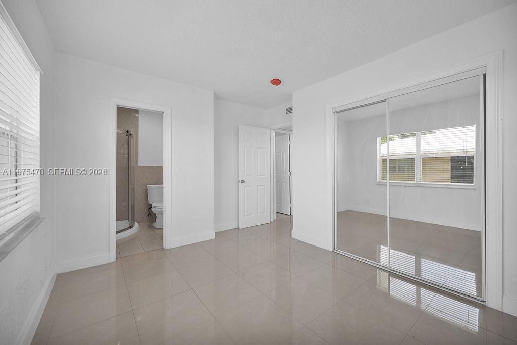 666 Kathy Court Pompano Beach, FL 33068 - Photo 21 of 45 a view of an empty room with a window