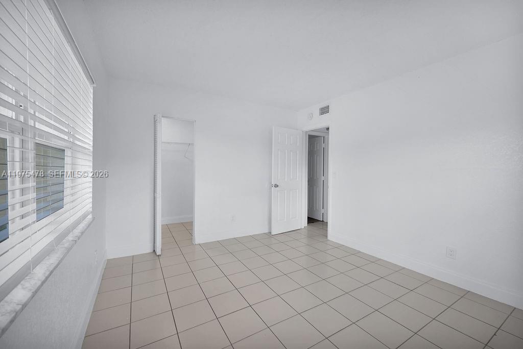 666 Kathy Court Pompano Beach, FL 33068 - Photo 24 of 45 a view of an empty room and window