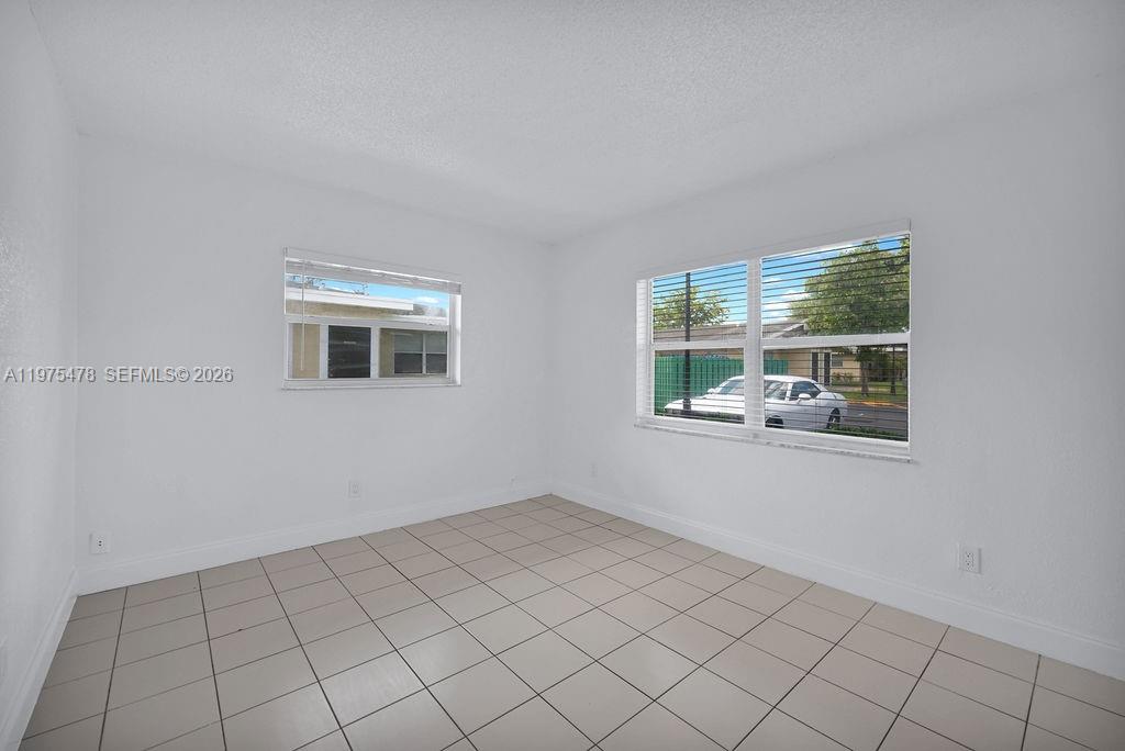 666 Kathy Court Pompano Beach, FL 33068 - Photo 25 of 45 a view of a room that has a window in it