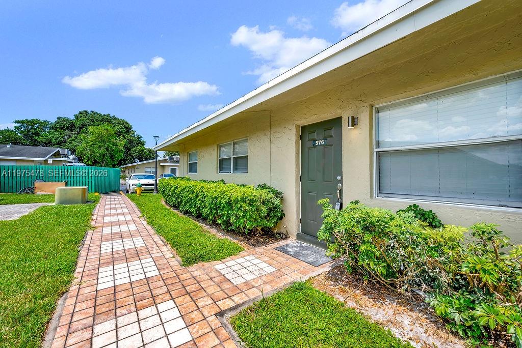 666 Kathy Court Pompano Beach, FL 33068 - Photo 41 of 45 a view of a house with a yard