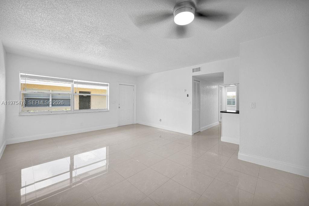 666 Kathy Court Pompano Beach, FL 33068 - Photo 6 of 45 a view of an empty room with a window