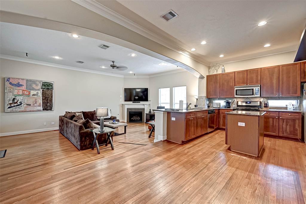 a large kitchen with stainless steel appliances lots of counter top space