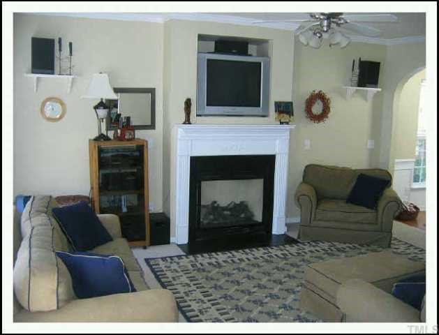 8416 Lunar Stone Place Raleigh, NC 27613 - Photo 5 of 10 Gas log fireplace and TV Niche in Living Room Other