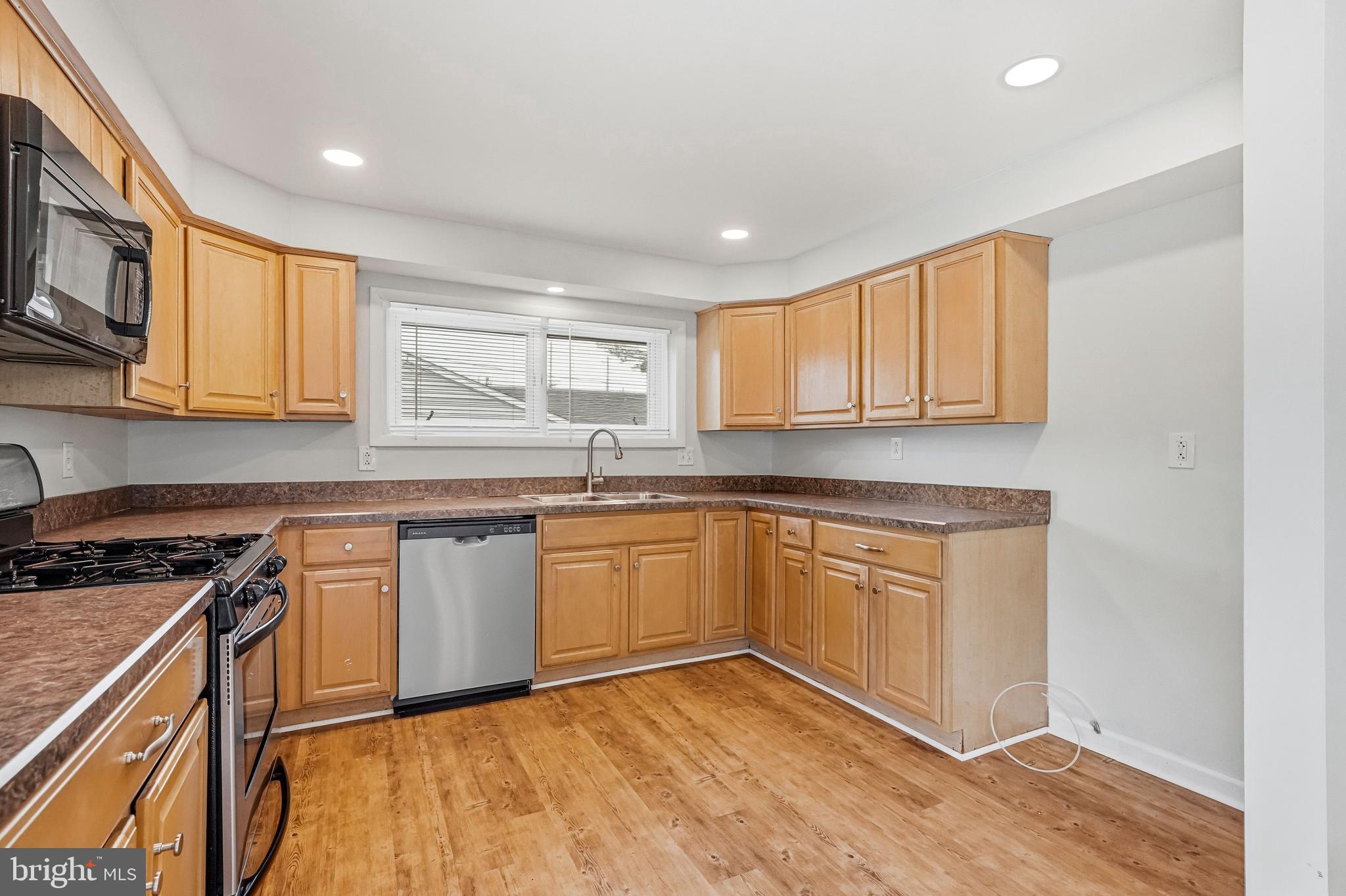 1286 Glassboro Road Williamstown, NJ 08094 - Photo 13 of 41 a kitchen with granite countertop cabinets stainless steel appliances a sink and a counter top space