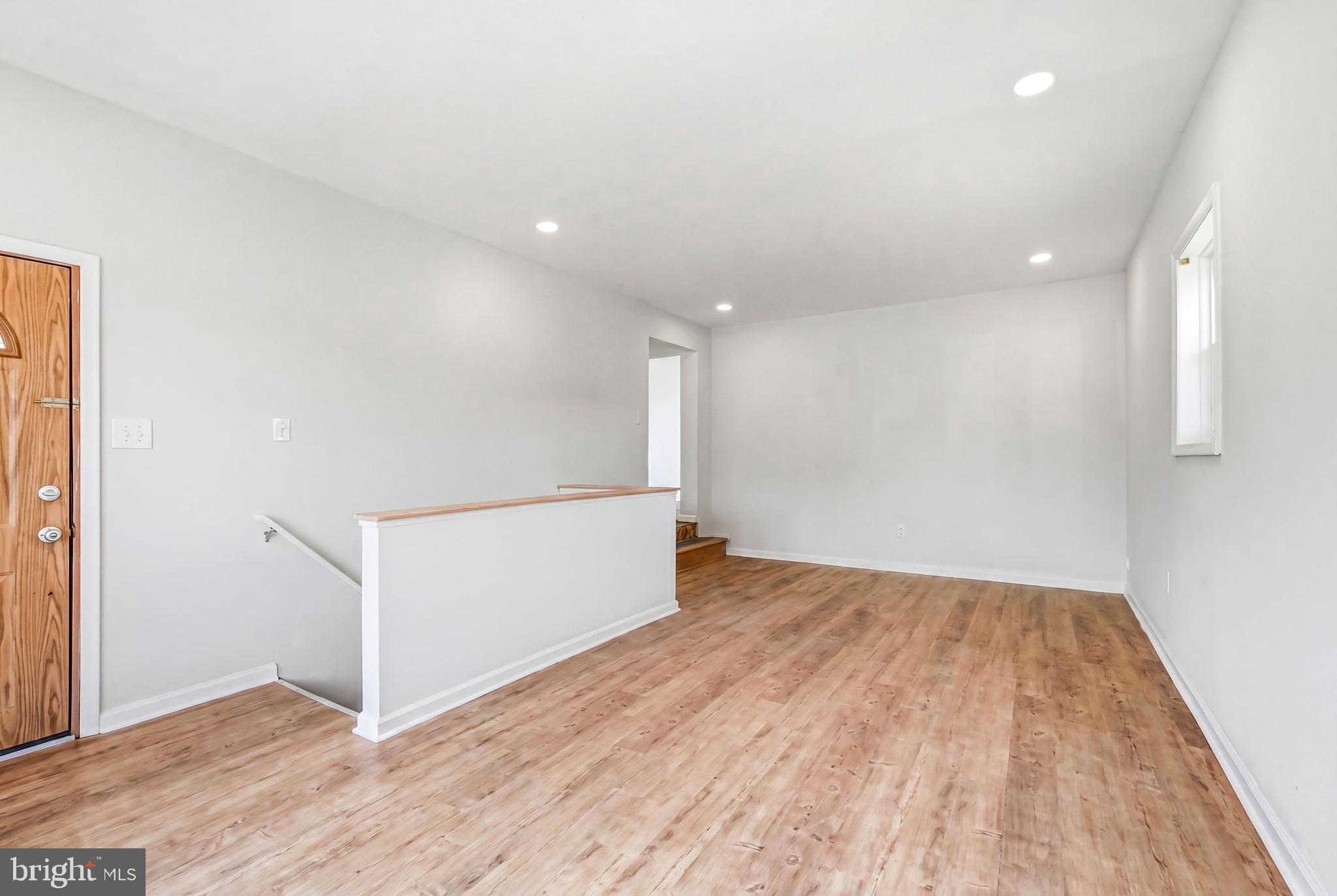 1286 Glassboro Road Williamstown, NJ 08094 - Photo 16 of 41 an empty room with wooden floor and windows