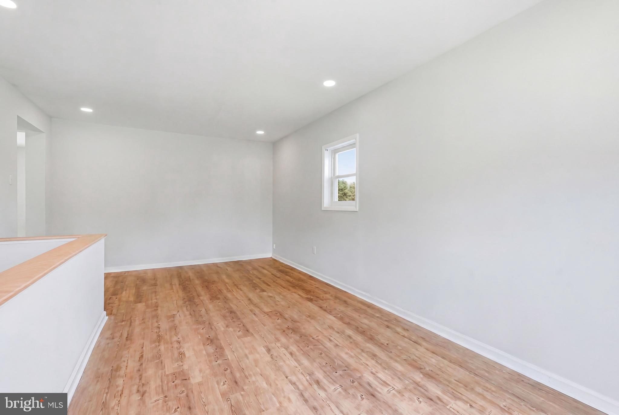 1286 Glassboro Road Williamstown, NJ 08094 - Photo 17 of 41 a view of empty room with wooden floor and fan