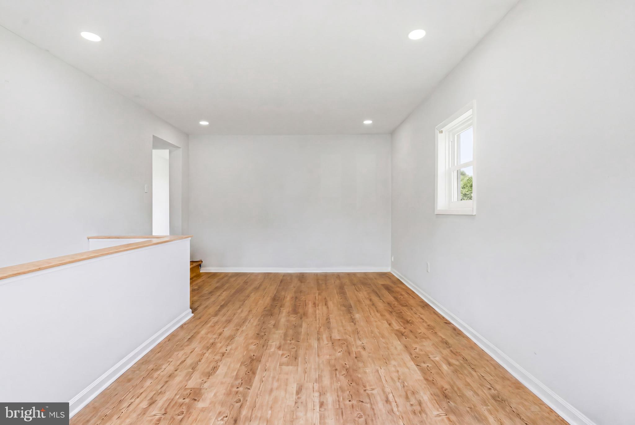 1286 Glassboro Road Williamstown, NJ 08094 - Photo 18 of 41 an empty room with wooden floor and windows