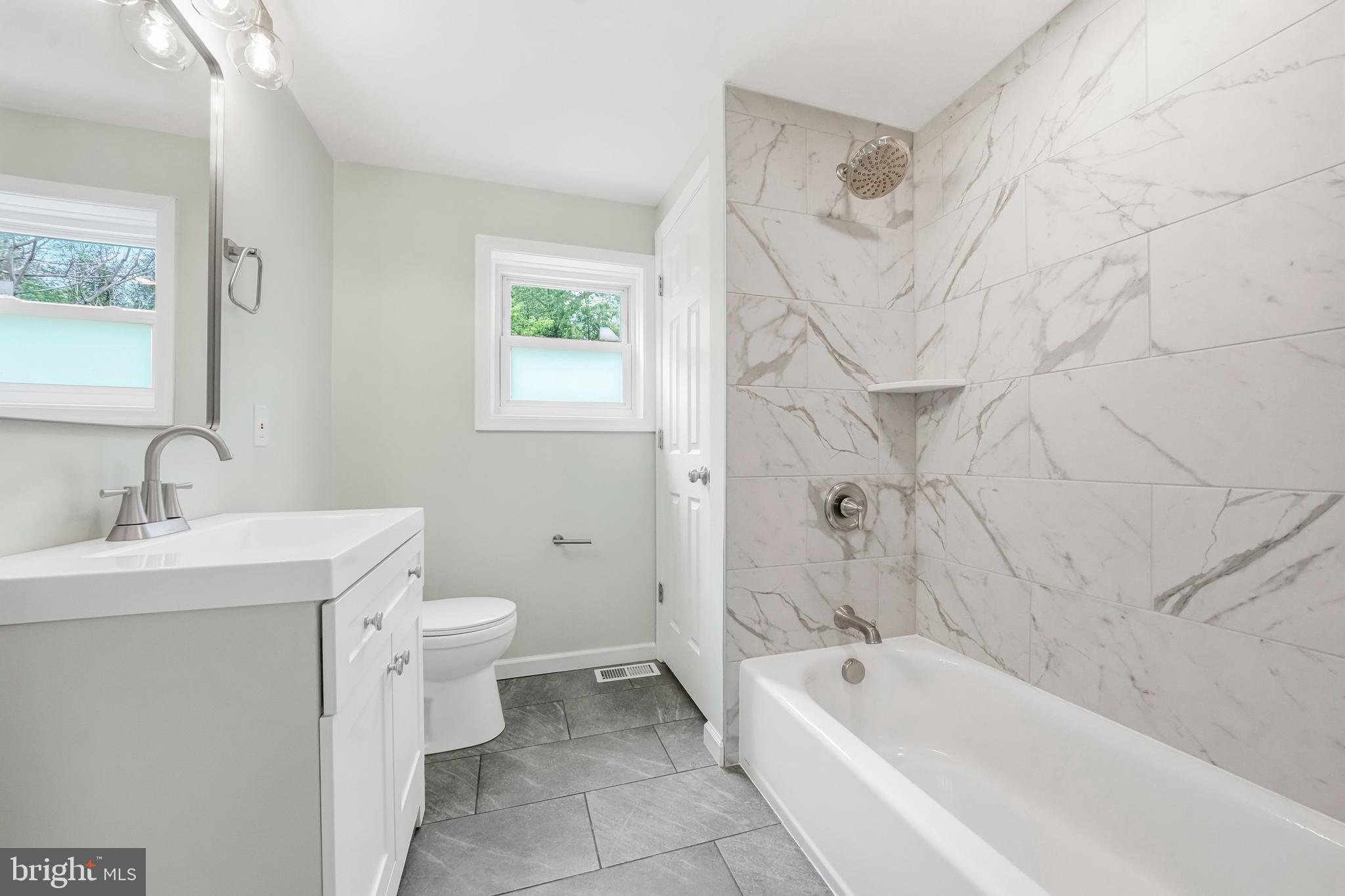 1286 Glassboro Road Williamstown, NJ 08094 - Photo 20 of 41 a bathroom with a sink a toilet and bathtub