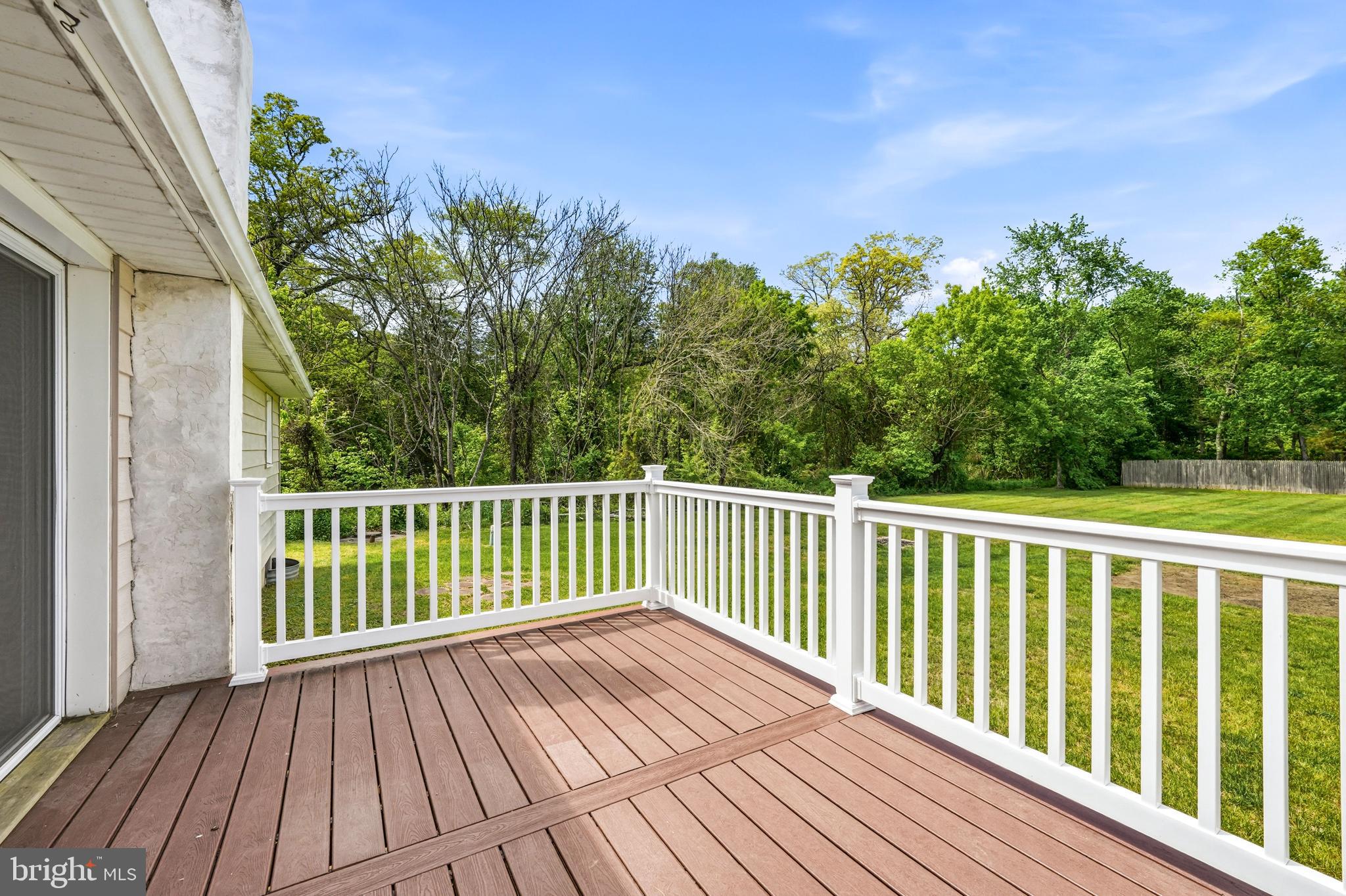 1286 Glassboro Road Williamstown, NJ 08094 - Photo 37 of 41 a balcony with wooden floor and trees in the back