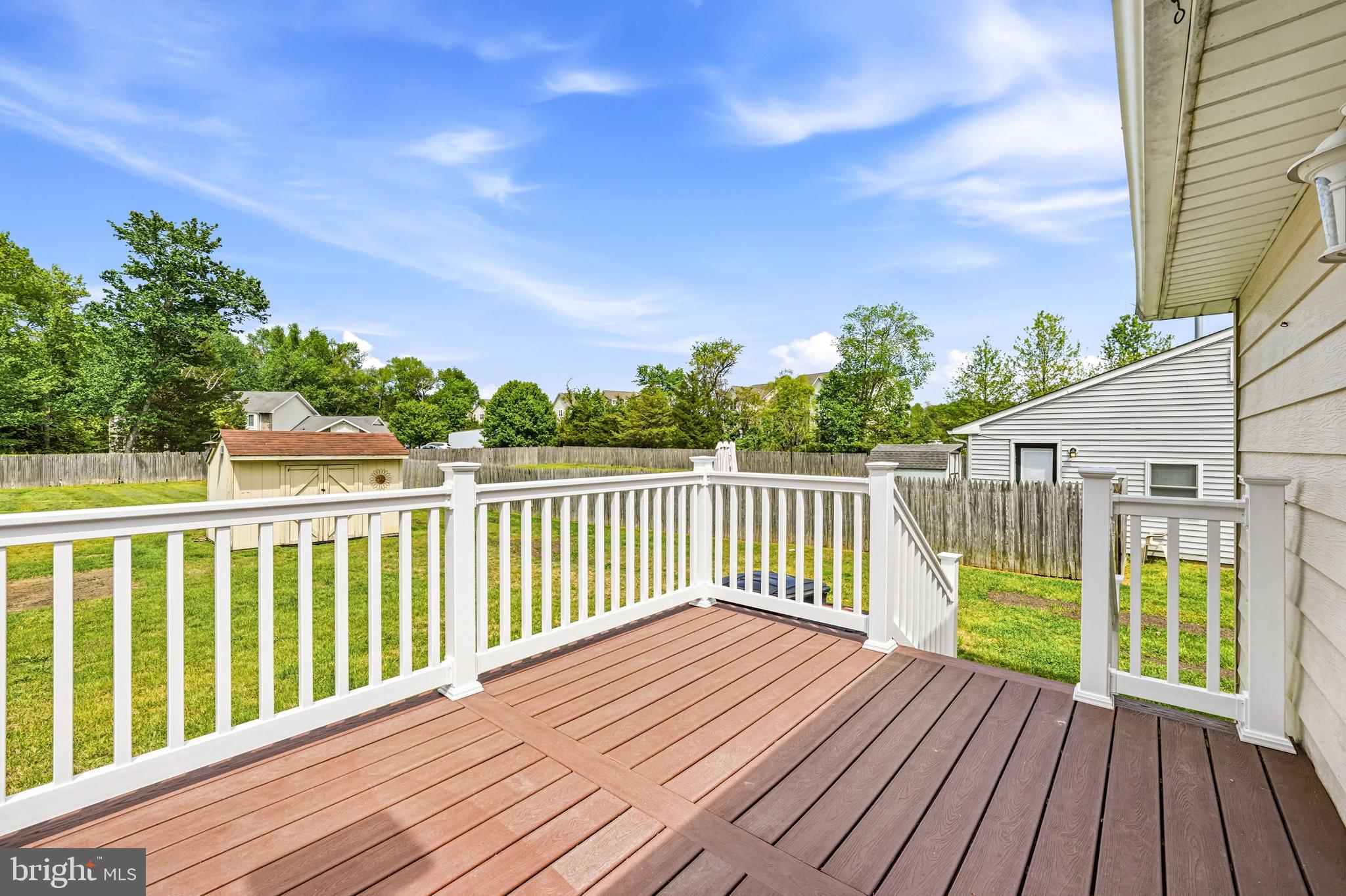 1286 Glassboro Road Williamstown, NJ 08094 - Photo 38 of 41 a view of deck with wooden floor and fence next to a yard