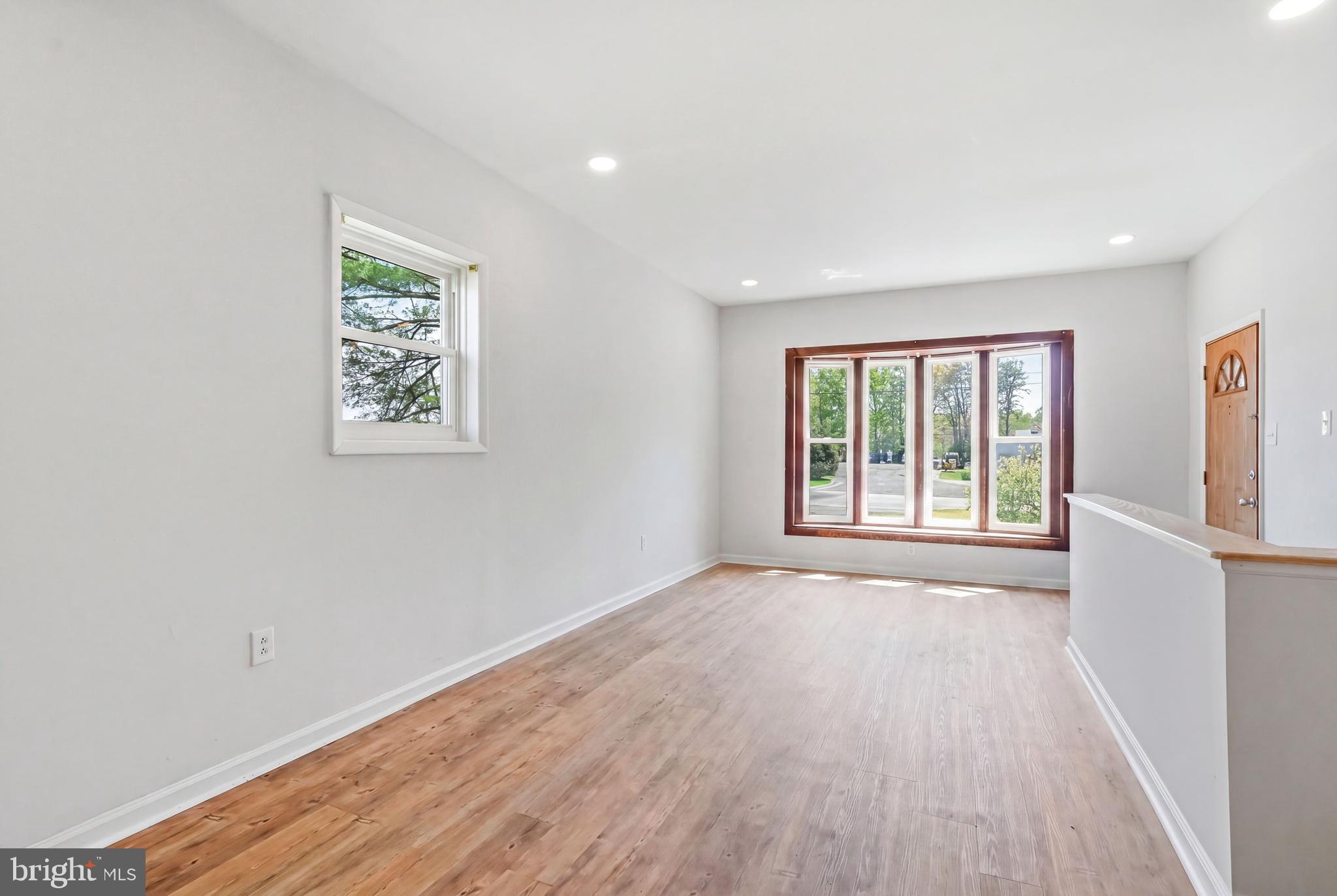 1286 Glassboro Road Williamstown, NJ 08094 - Photo 7 of 41 a view of an empty room with wooden floor and a window