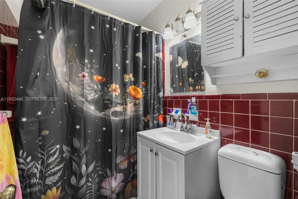 a bathroom with a sink and mirror