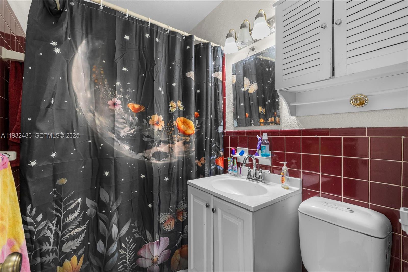 60 West 61st Street Hialeah, FL 33012 - Photo 14 of 43 a bathroom with a sink and mirror