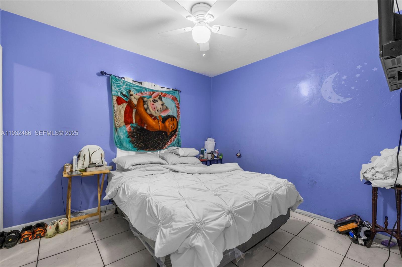 60 West 61st Street Hialeah, FL 33012 - Photo 15 of 43 a bedroom with a bed and a chandelier