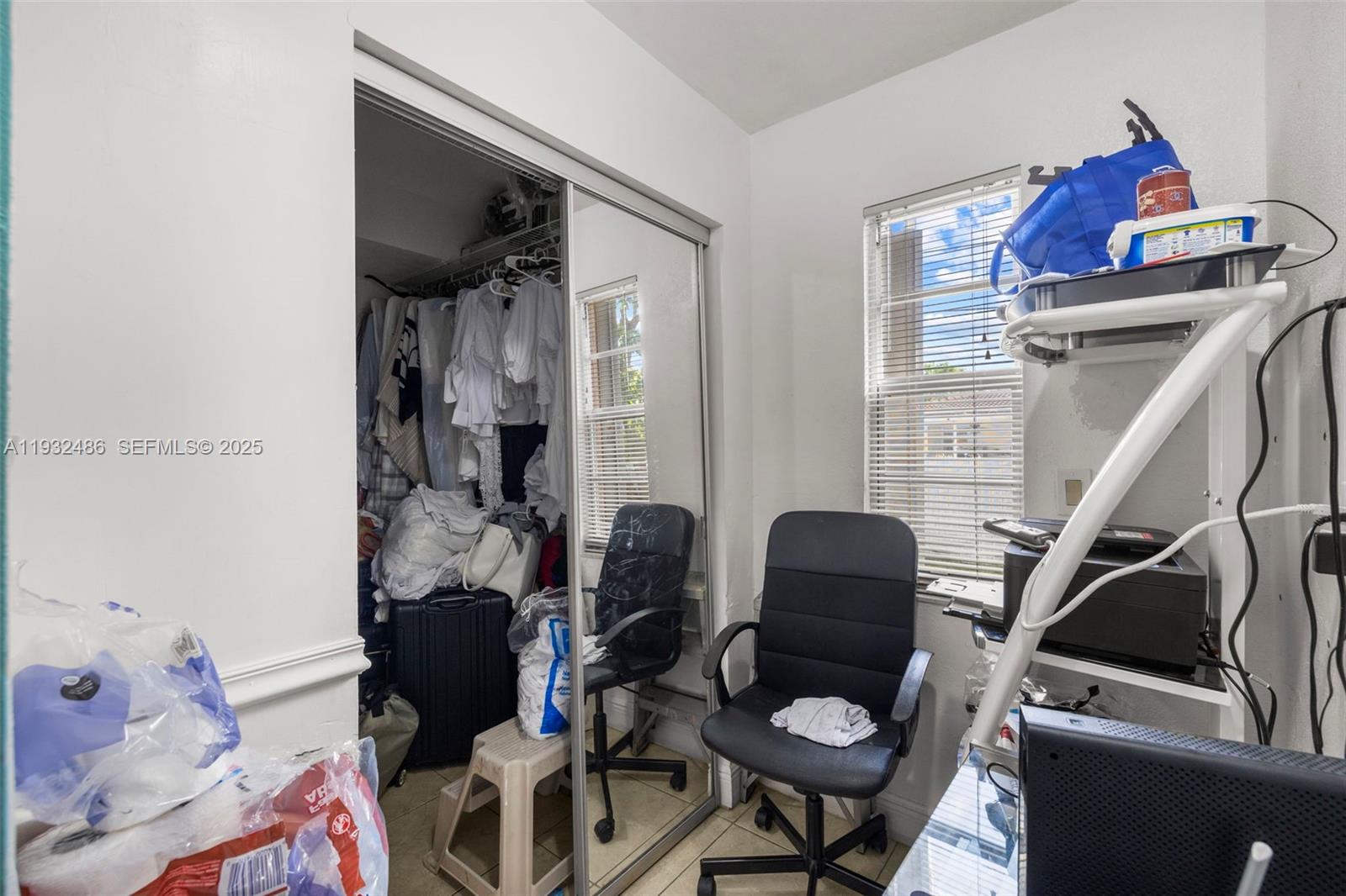 60 West 61st Street Hialeah, FL 33012 - Photo 17 of 43 a living room with furniture and a chair