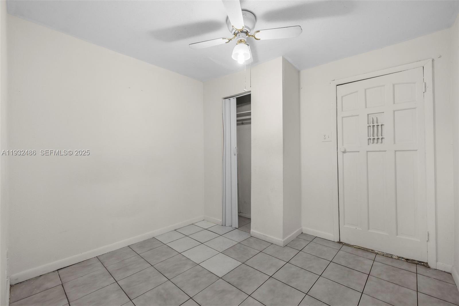 60 West 61st Street Hialeah, FL 33012 - Photo 23 of 43 an empty room with windows and fan
