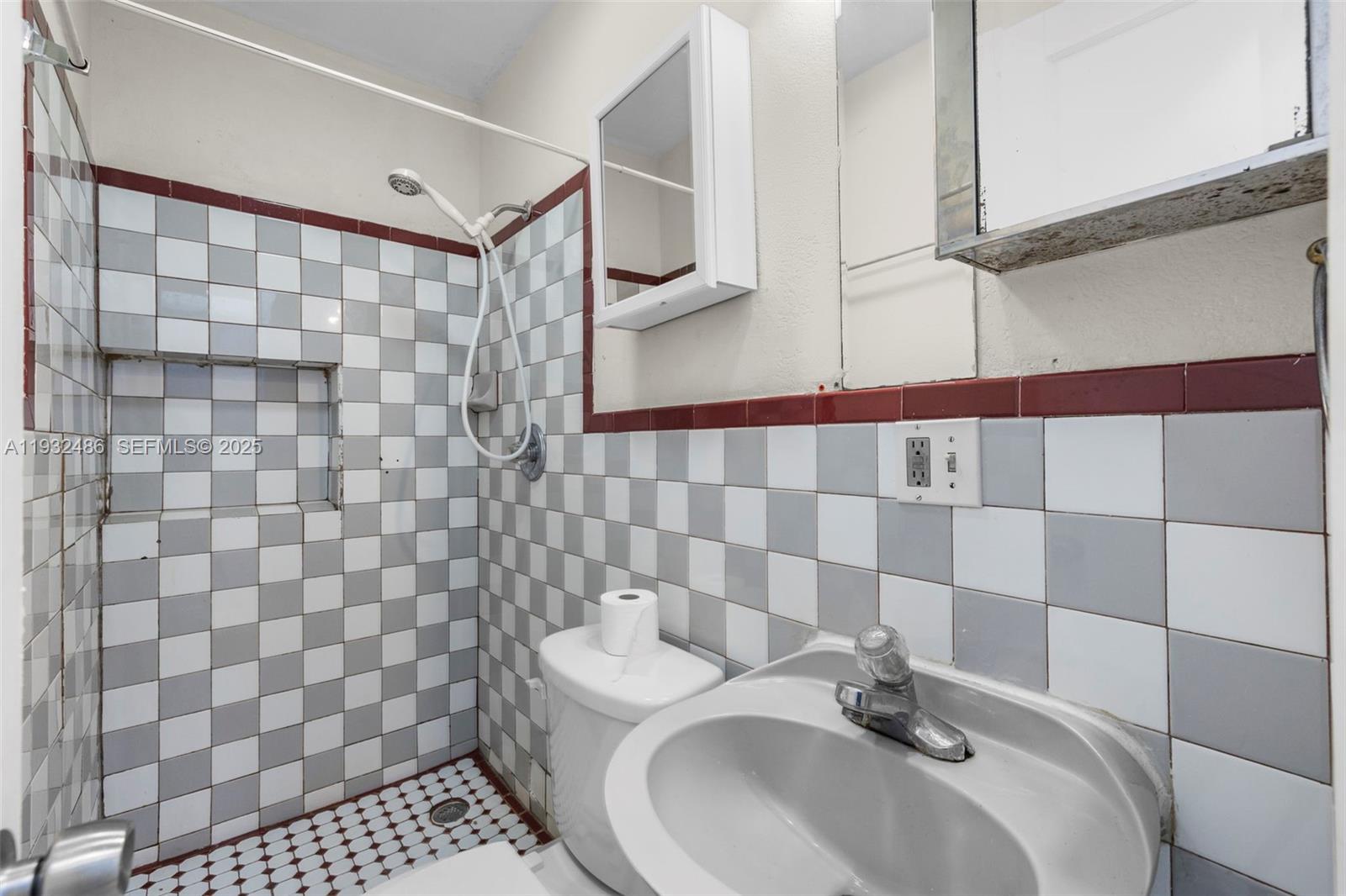 60 West 61st Street Hialeah, FL 33012 - Photo 24 of 43 a bathroom with a sink a toilet and shower