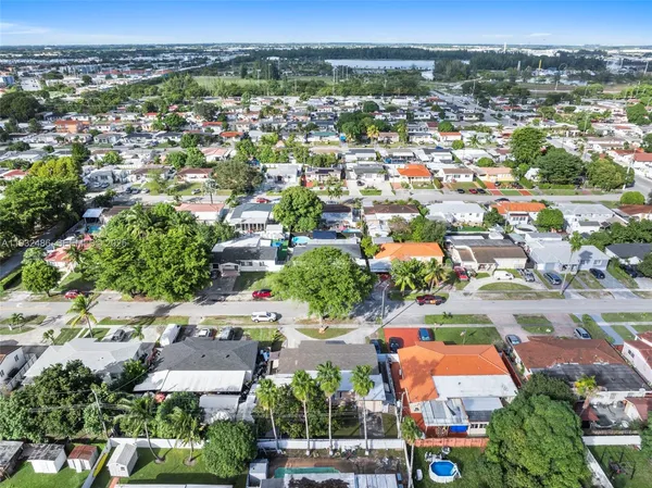 an aerial view of residential houses with outdoor space