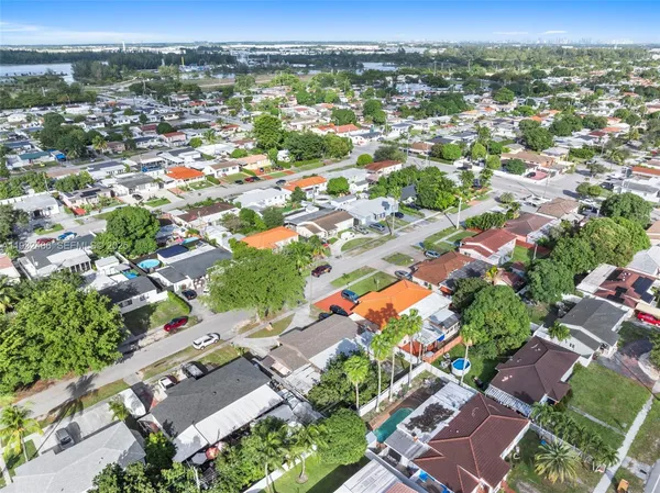 an aerial view of residential houses with outdoor space