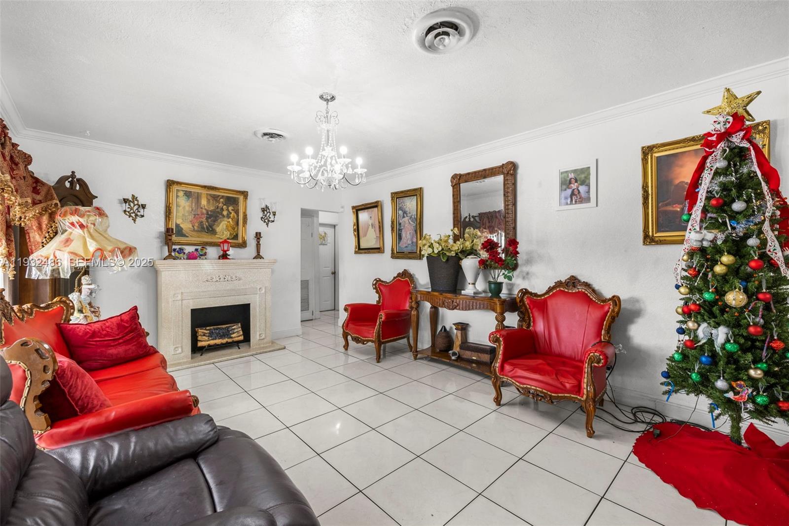 60 West 61st Street Hialeah, FL 33012 - Photo 4 of 43 a living room with furniture and a fireplace