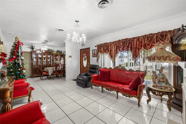 a bedroom with furniture and a chandelier