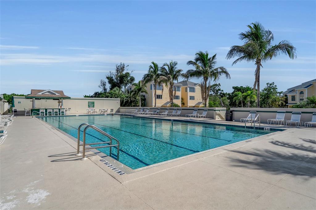 848 Evergreen Way Longboat Key, FL 34228 - Photo 55 of 66 a view of swimming pool with a yard and seating area