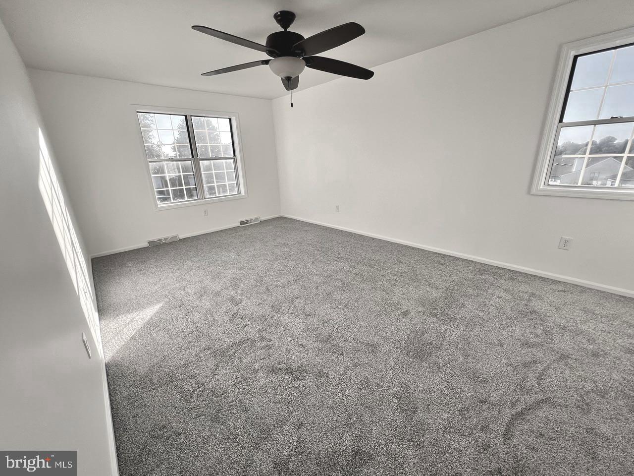 112 Spring Ridge Court Lancaster, PA 17601 - Photo 14 of 19 an empty room with windows and ceiling fan view