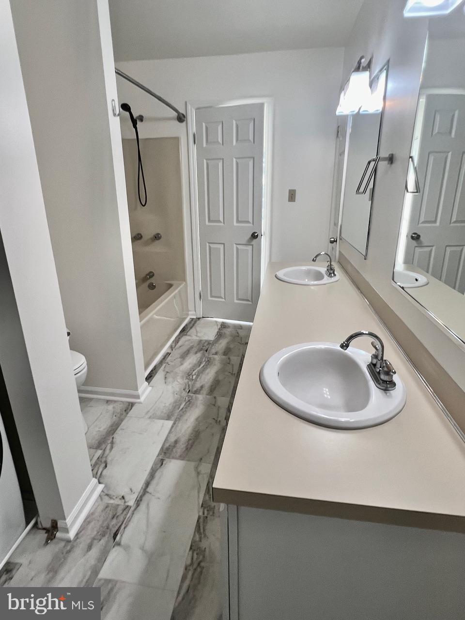 112 Spring Ridge Court Lancaster, PA 17601 - Photo 17 of 19 a bathroom with a sink a toilet and a mirror