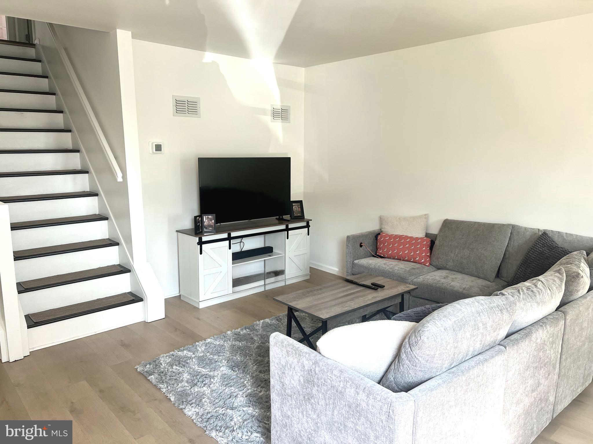 112 Spring Ridge Court Lancaster, PA 17601 - Photo 9 of 19 a living room with furniture and a flat screen tv