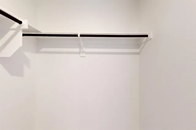 a backyard of a house with barbeque oven