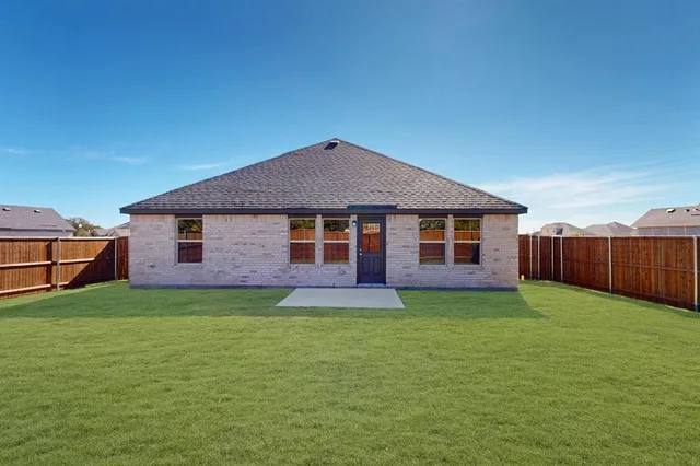 a sign that is sitting in front of flowers