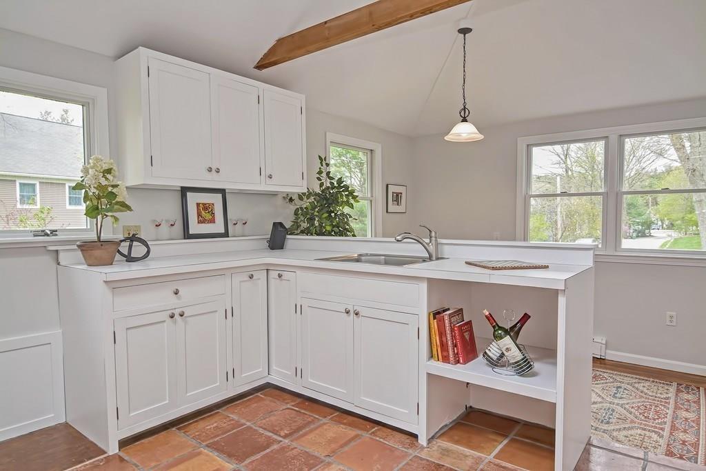 18 Massasoit Path Wayland, MA 01778 - Photo 13 of 39 a kitchen with a sink and cabinets