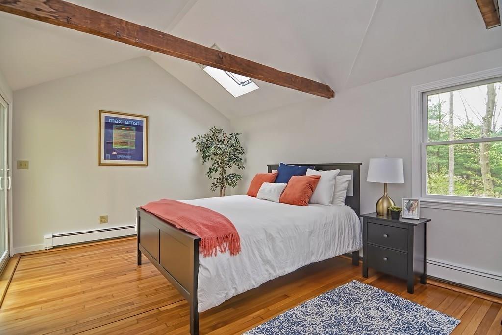 18 Massasoit Path Wayland, MA 01778 - Photo 14 of 39 a bedroom with a bed and wooden floor