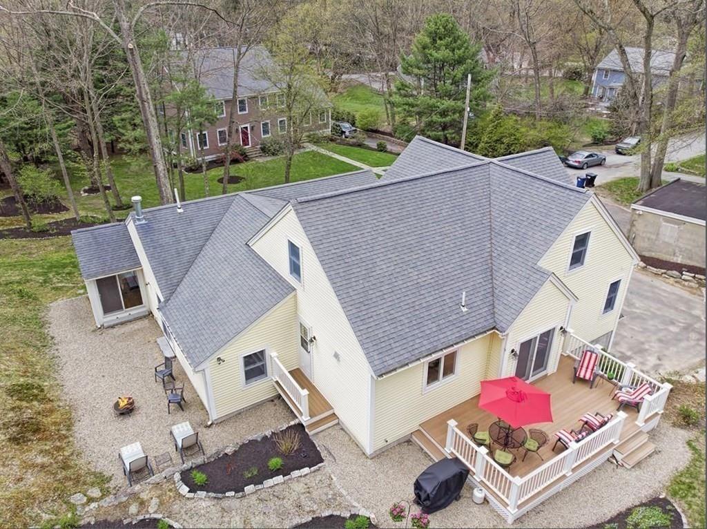 18 Massasoit Path Wayland, MA 01778 - Photo 5 of 39 an aerial view of a house with a garden