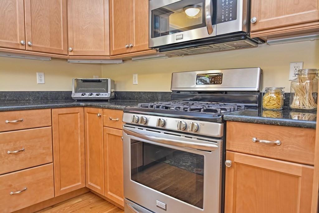 18 Massasoit Path Wayland, MA 01778 - Photo 9 of 39 a kitchen with granite countertop cabinets stainless steel appliances and a counter space
