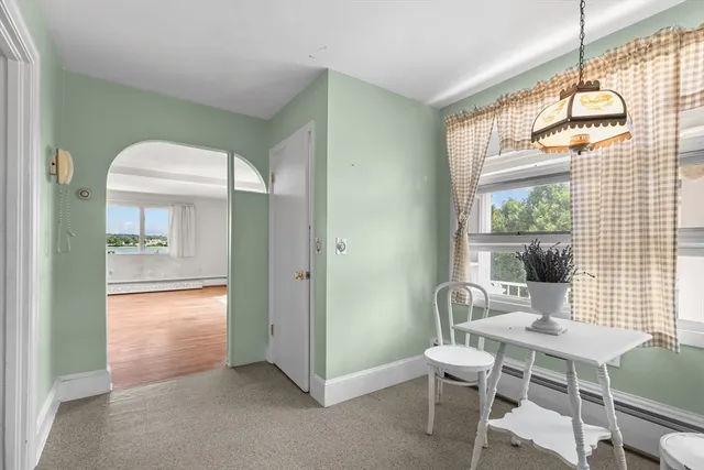 a dining room with furniture and window