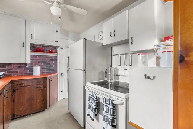 a kitchen with sink cabinets and window
