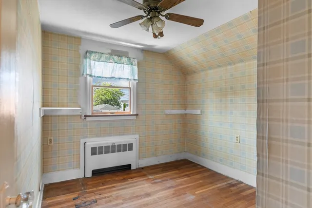 a view of a bathroom with wooden floor