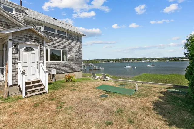 a view of a lake with a yard