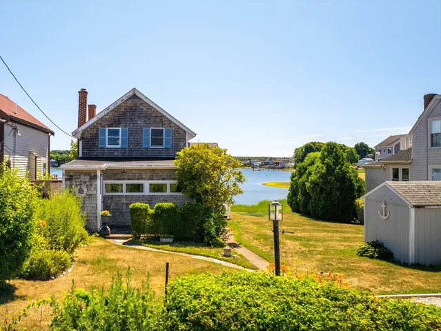an aerial view of a house with swimming pool and outdoor space